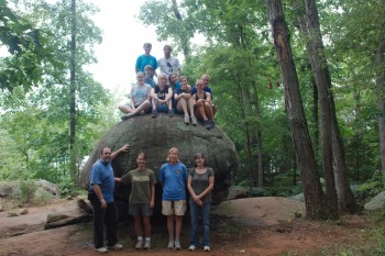 The hiking group on a large boulder near Lake Pinchot
