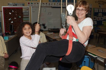 Chris Being Lifted By A Second Grade Student
