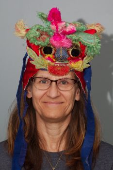 Cathy with a Chinese Dragon Hat